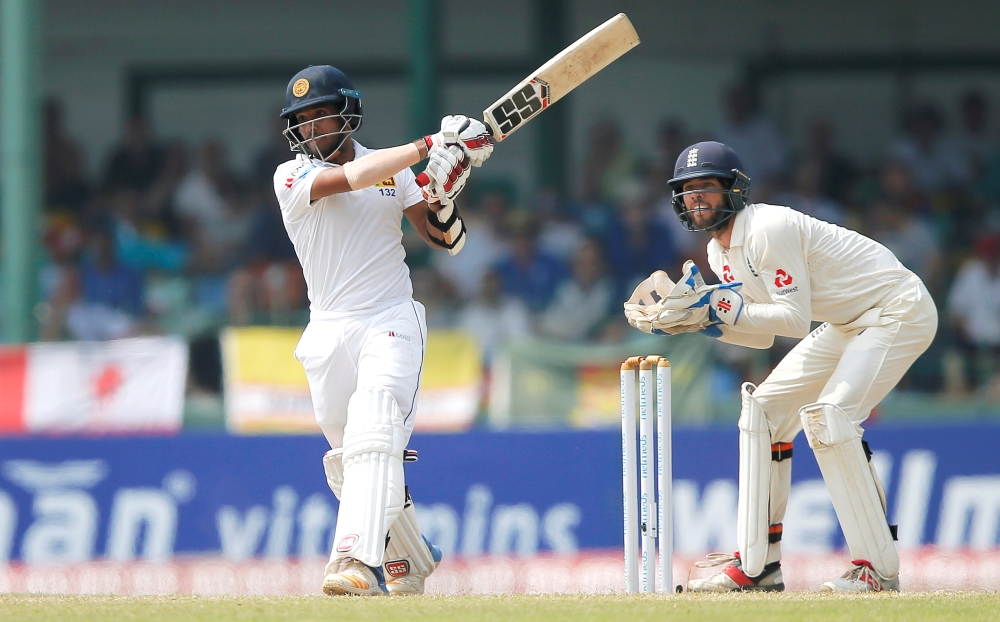File Photo: Sri Lanka's Kusal Mendis (L) plays a shot next to England's wicket keeper Ben Foakes. REUTERS/Dinuka Liyanawatte/File Photo