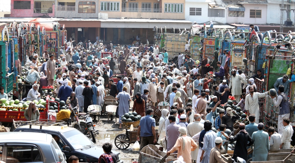 ISLAMABAD, PAKISTAN, MAY 9: Pakistani vendors purchase seasonal fruits at the main fruit and vegetables market during the Muslim's holy month of Ramadan as Pakistan gradually ease nationwide coronavirus related 