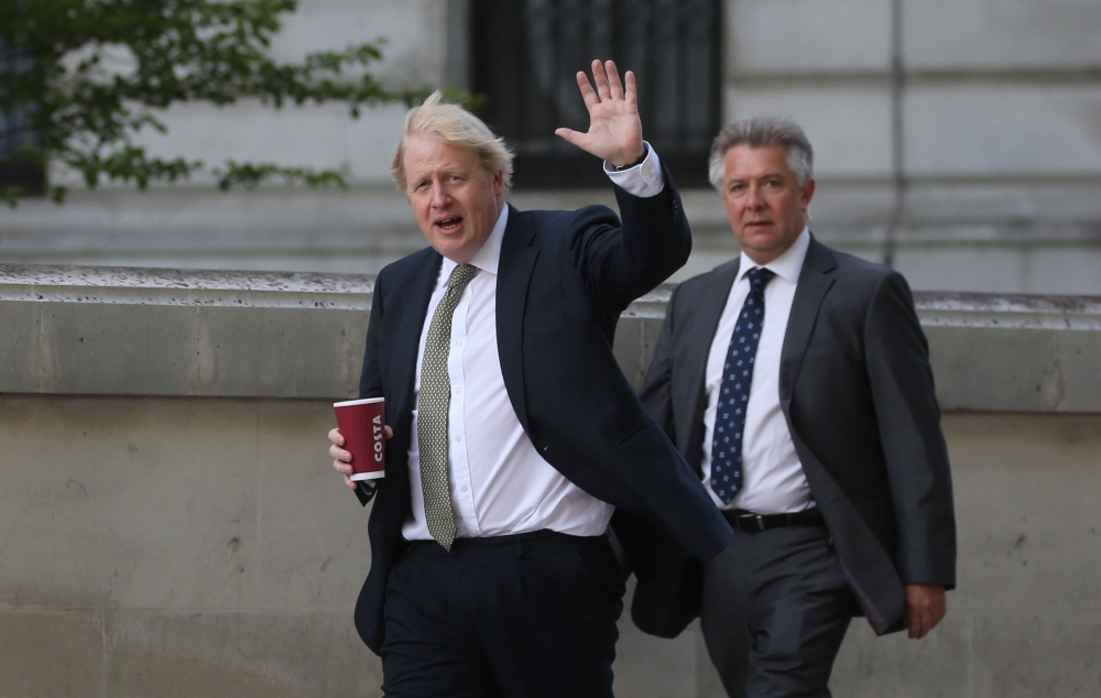 :LONDON, UNITED KINGDON - MAY 06: Britain's Prime Minister Boris Johnson (L) returns to Downing Street after his daily walk in Westminster in London, United Kingdom on May 06, 2020. ( Isabel Infantes - Anadolu Agency )
