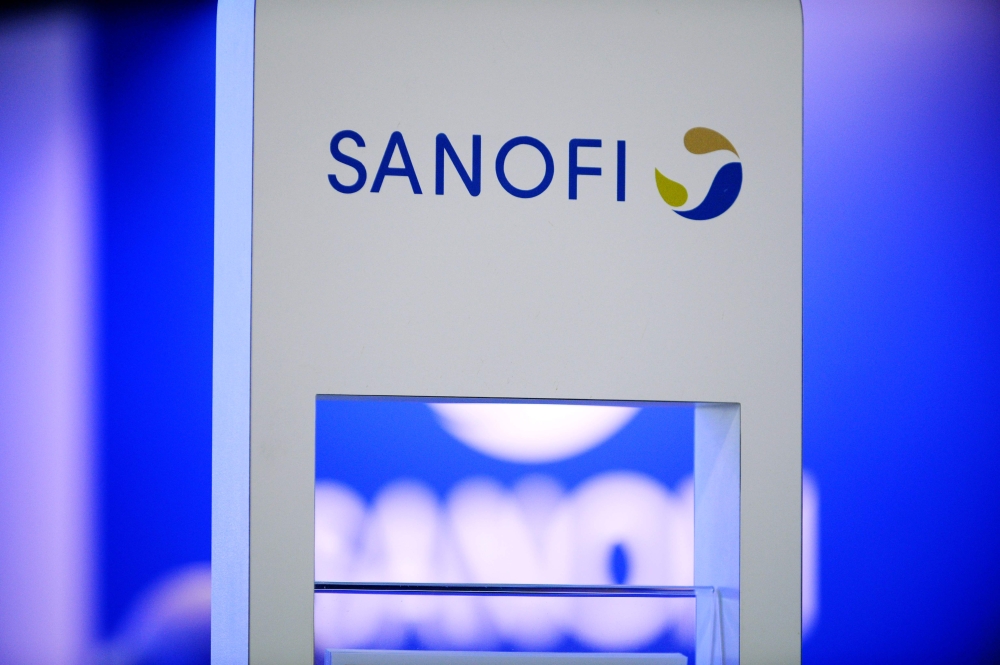 :(FILES) This file photo taken on November 18, 2016 shows the logo of French multinational pharmaceutical company Sanofi for which French government warned on May 14, 2020 that it would be 