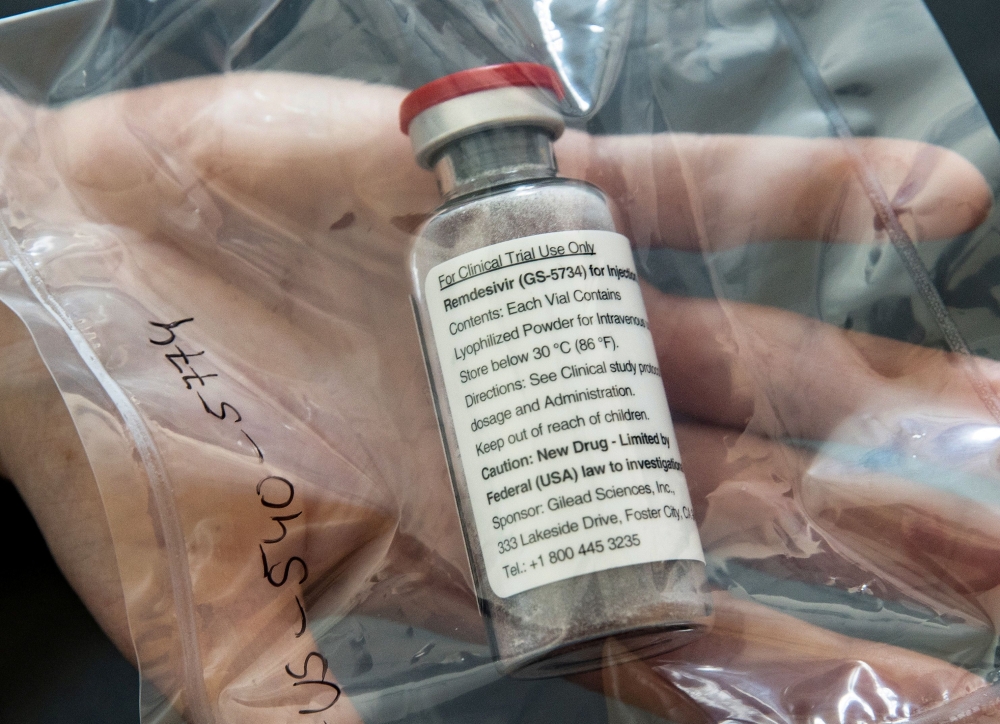 FILE PHOTO: An ampule of drugmaker Gilead's remdesivir, which has won emergency approval as a treatment for COVID-19 in Japan, is pictured during a news conference at the University Hospital Eppendorf (UKE) in Hamburg, Germany, April 8, 2020. Ulrich Perre