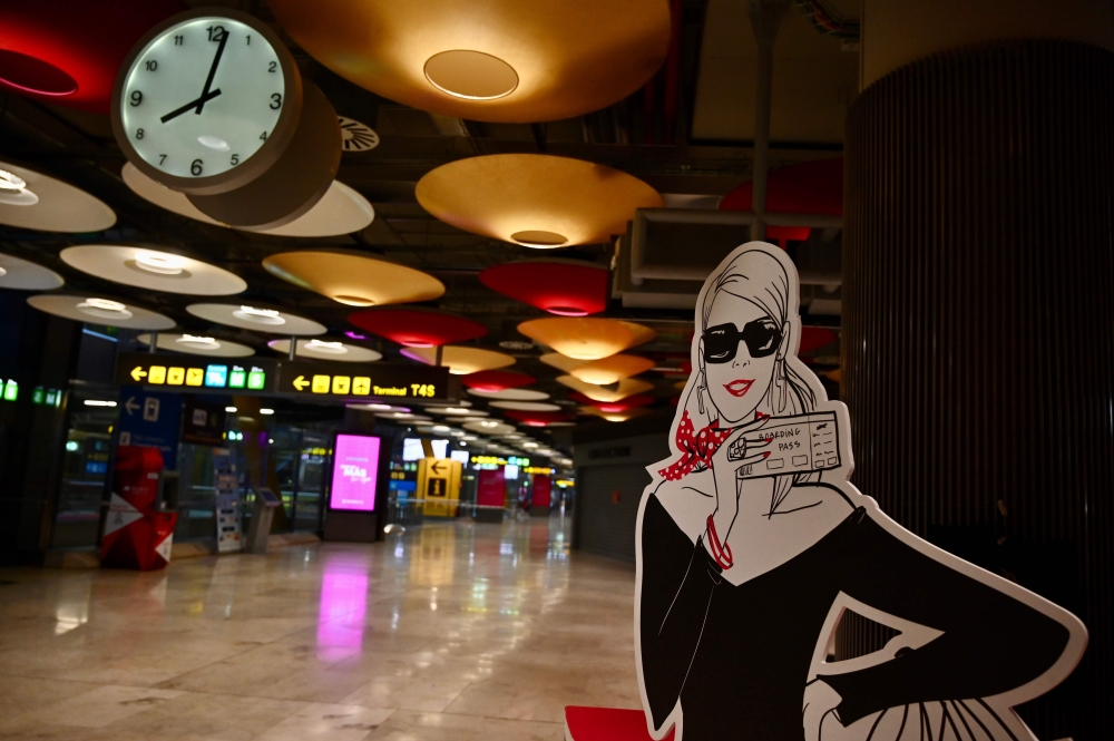 :Picture shows the terminal 4 of the Madrid-Barajas Adolfo Suarez airport in Barajas on May 16, 2020.  AFP / GABRIEL BOUYS
