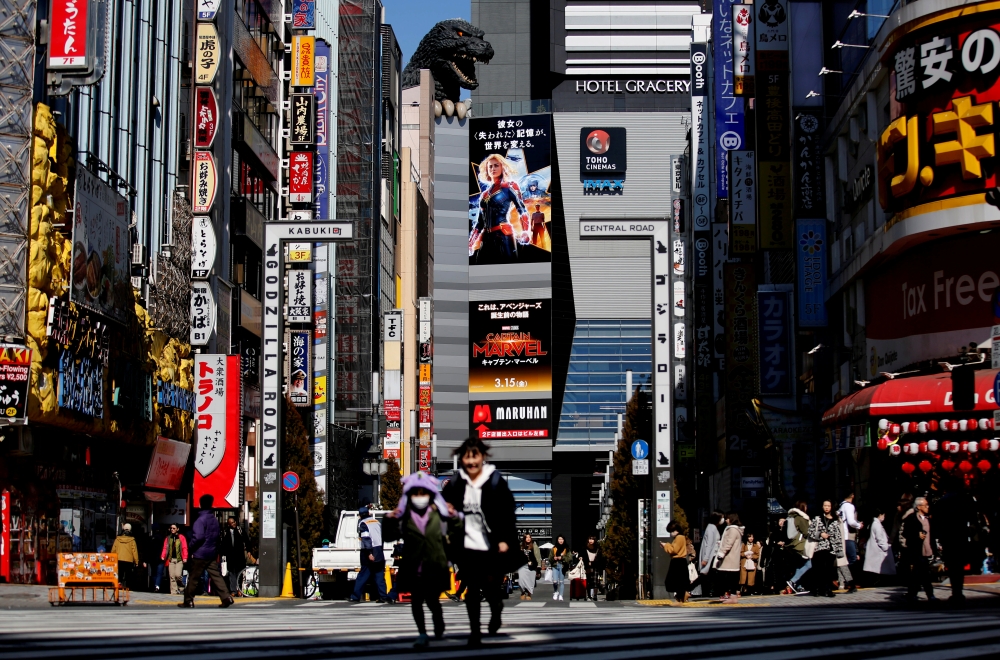 FILE PHOTO: The head of Godzilla, a Japanese monster movie character, is seen on a building of Toho Cinema in Tokyo, Japan, February 18, 2019. REUTERS/Kim Kyung-hoon/File Photo