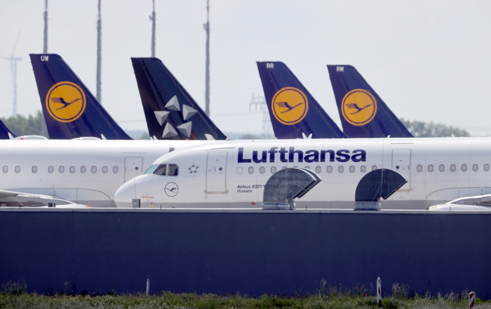 FILE PHOTO: Airplanes of German carrier Lufthansa at the Berlin Schoenefeld airport, Germany, May 26, 2020. REUTERS/Fabrizio Bensch
