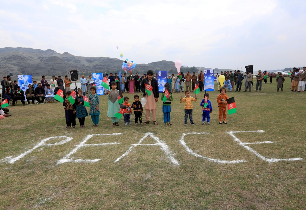 FILE PHOTO: Afghan children celebrate in anticipation of the U.S-Taliban agreement to allow a U.S. troop reduction and a permanent ceasefire, in Jalalabad, Afghanistan February 28, 2020. REUTERS/Parwiz

