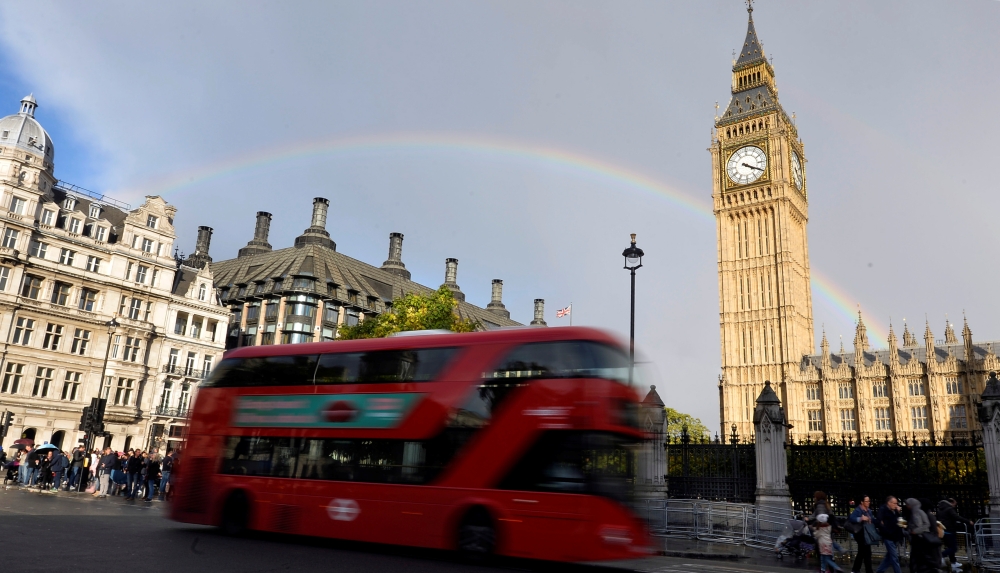 FILE PHOTO: A rainbow is seen behind the Big Ben clock tower, at the Houses of Parliament in central London, Britain, October 16, 2016. REUTERS/Hannah McKay/File Photo
