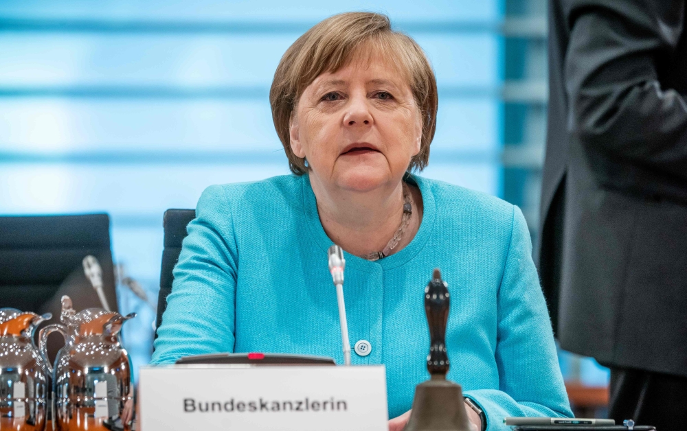 German Chancellor Angela Merkel looks on at the start of the weekly cabinet meeting on June 3, 2020 at the Chancellery in Berlin. AFP / POOL / Michael Kappeler