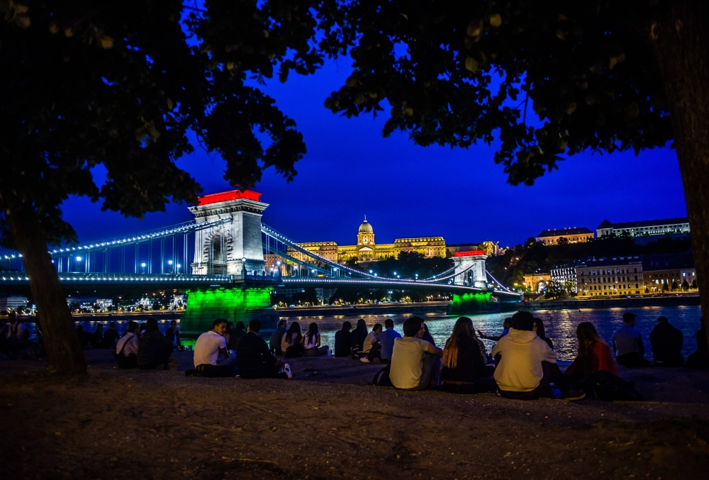 The Chain Bridge is illuminated in the colours of the Hungarian national flag in Budapest on June 4, 2020, as an event to commemorate the 100th anniversary of the Trianon WWI peace agreement. / AFP / FERENC ISZA