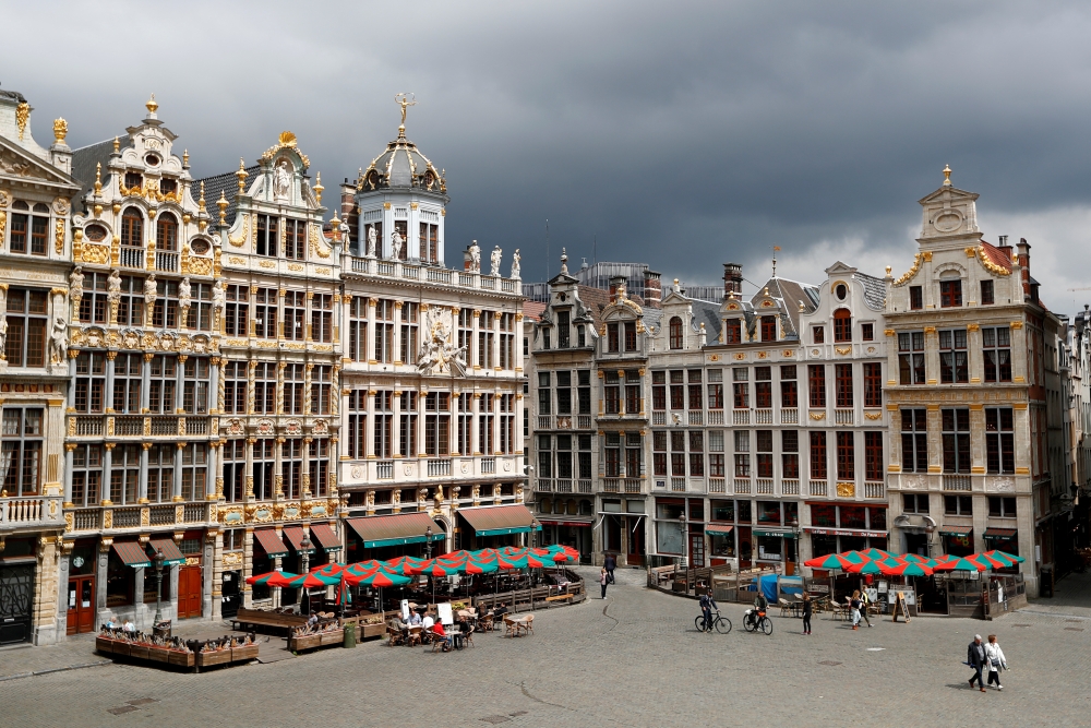 People sit on terraces on Brussels Grand Place square as restaurants and bars reopen after weeks of lockdown restrictions following the coronavirus disease (COVID-19) outbreak, in Brussels, Belgium, June 8, 2020. REUTERS/Francois Lenoir/File Photo