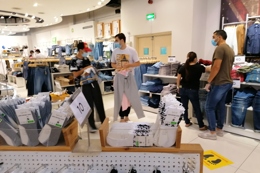 Customers shop at an outlet in City Center, as commercial centres reopened with limited capacity yesterday. 
Pic: Salim Matramkot/ThePeninsula   