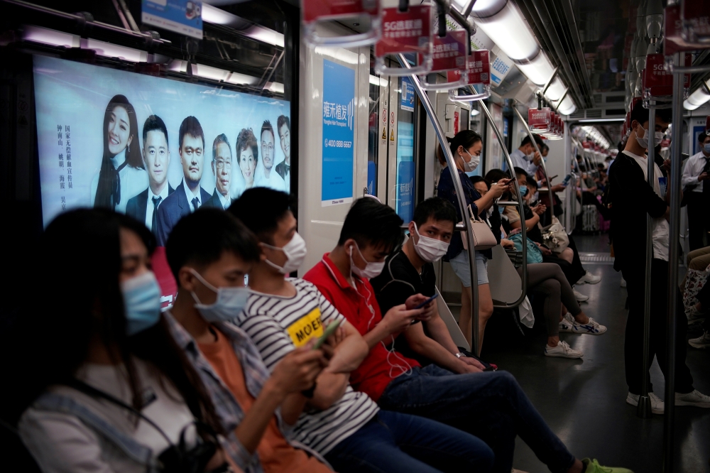 People wearing face masks are seen in a subway car in Shanghai, following the coronavirus disease (COVID-19) outbreak, China June 16, 2020. REUTERS/Aly Song
