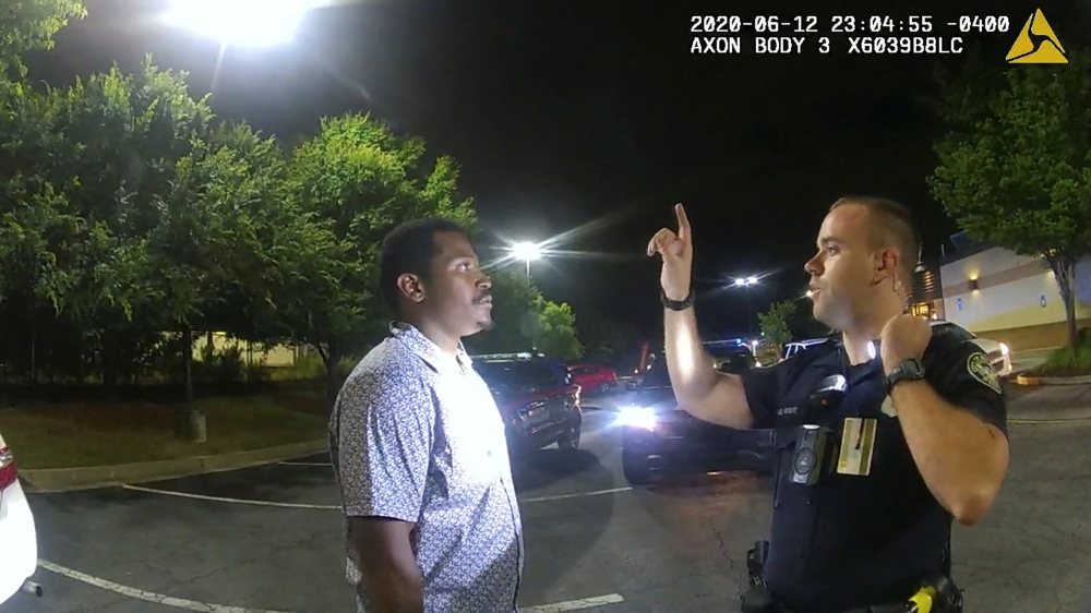 Former Atlanta Police Department officer Garrett Rolfe conducts a field sobriety test on 27-year-old Rayshard Brooks in a Wendy's restaurant parking lot in a still image from the video body camera of officer Devin Bronsan in Atlanta, Georgia, U.S. June 12