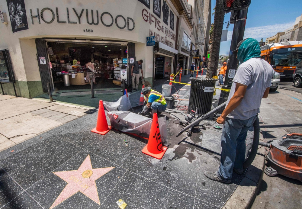 Workers clean up a 