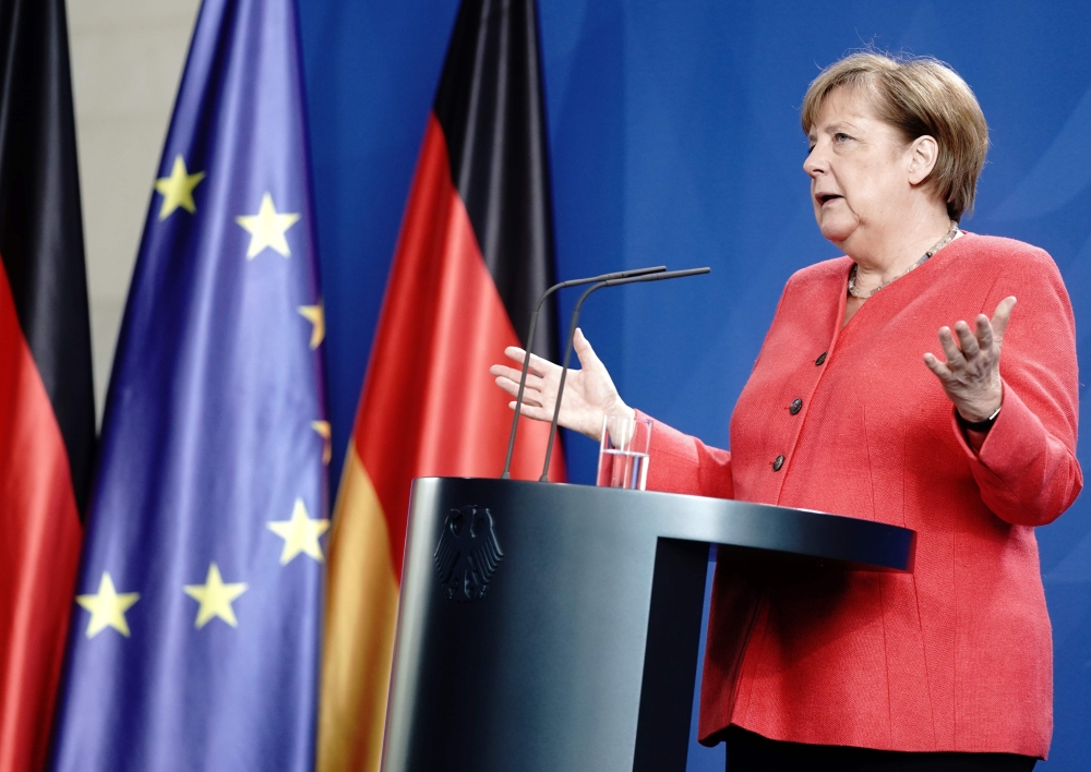 German Chancellor Angela Merkel speaks during a press conference on June 19, 2020 in Berlin after a video conference with members of the European Council aiming at discussing the planned economic package for reconstruction after the new coronavirus pandem
