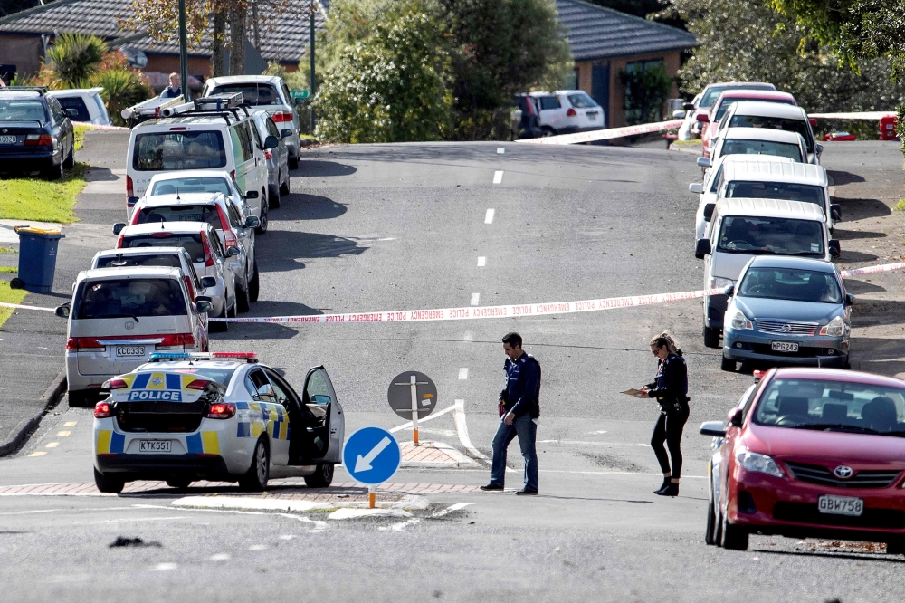 Police officers cordon off an area after a shooting incident in a residential neighbourhood in Auckland on June 19, 2020. An unarmed New Zealand police officer was shot dead on an Auckland street on June 19 in a rare fatal attack that Prime Minister Jacin