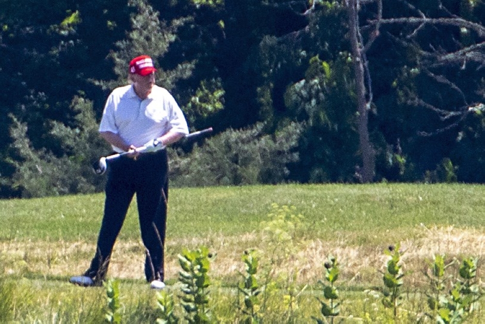 U.S. President Donald Trump golfs at Trump National Golf Club on June 21, 2020 in Potomac Falls, Virginia. 