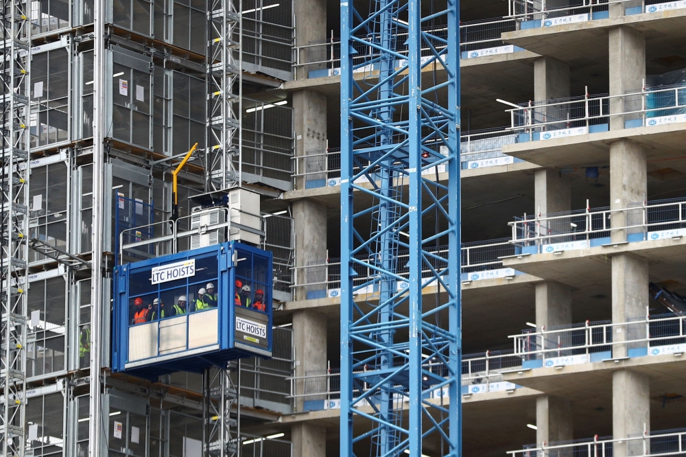Workers are seen at a construction site, following the coronavirus disease (COVID-19) outbreak, in London, Britain June 30, 2020. REUTERS/Hannah McKay