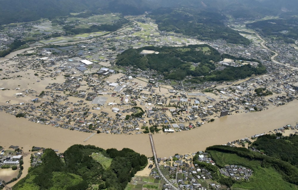 An aerial view shows flooded Kuma River caused by a heavy rain at a residential area in Hitoyoshi, Kumamoto prefecture, southern Japan, in this photo taken by Kyodo July 4, 2020. Mandatory credit Kyodo/via REUTERS 