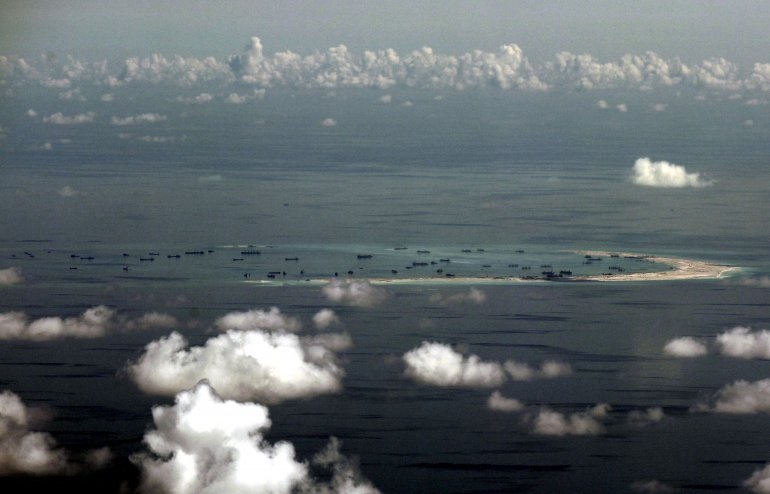 An aerial photo shows the alleged on-going land reclamation by China on mischief reef in the Spratly Islands in the South China Sea, May 11, 2015. Reuters / Ritchie B Tongo