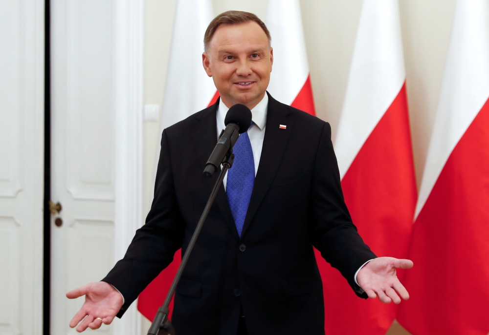Polish President and presidential candidate of the Law and Justice (PiS) party Andrzej Duda talks to the media after the announcement of the first exit poll results on the second round of the presidential election, at the Presidential Palace in Warsaw, Po