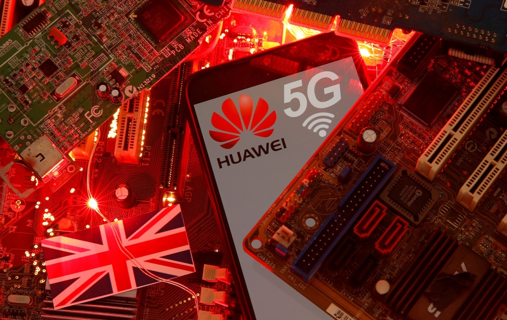 FILE PHOTO: The British flag and a smartphone with a Huawei and 5G network logo are seen on a PC motherboard in this illustration picture taken January 29, 2020. REUTERS/Dado Ruvic/Illustration/File Photo
