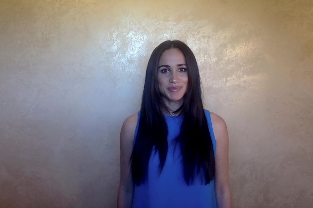 Meghan Markle, Duchess of Sussex, poses before addressing the keynote 