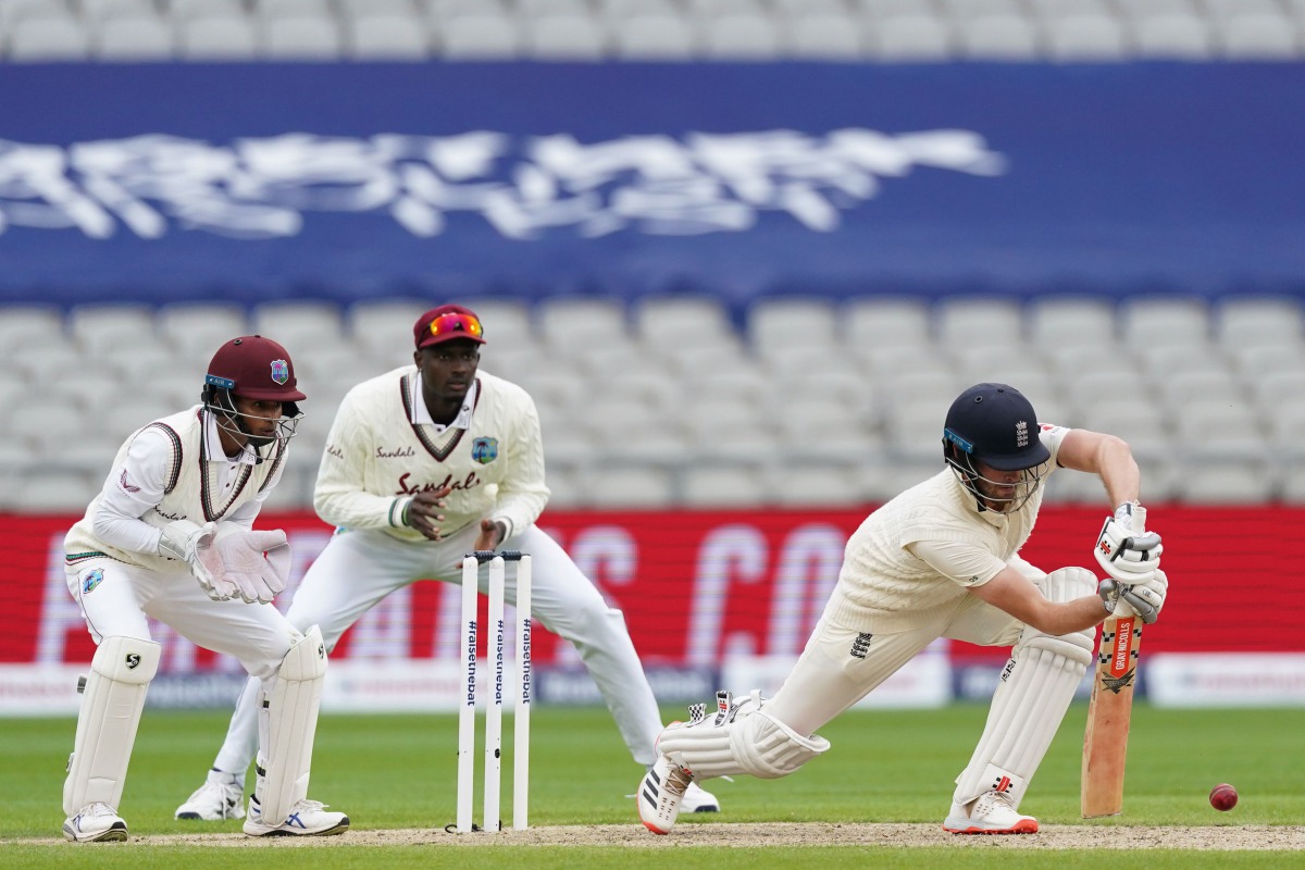 England's Dom Sibley plays a shot on the first day of the second Test cricket match between England and the West Indies at Old Trafford in Manchester, northwest England on July 16, 2020.