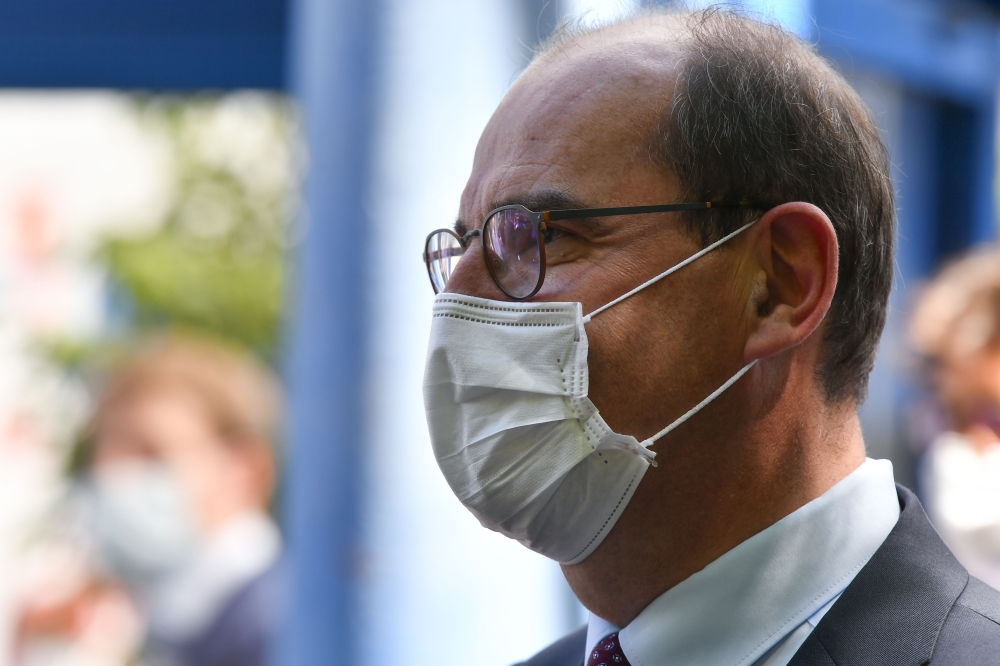 French Prime Minister Jean Castex, wearing a face mask, speaks after attending a city council and resigning from his mayor's office, in Prades, southwestern France, on July 18, 2020.  / AFP / GEORGES GOBET