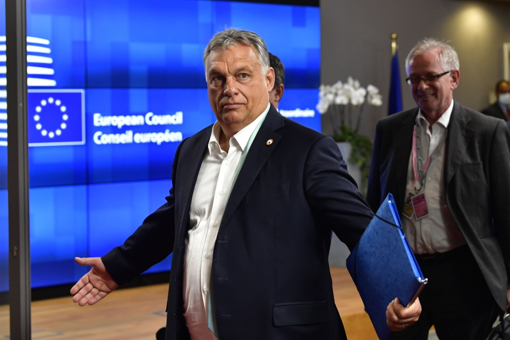 Hungary's Prime Minister Viktor Orban leaves after a meeting of an EU summit on a coronavirus recovery package at the European Council building in Brussels on July 18, 2020. AFP / POOL / JOHN THYS