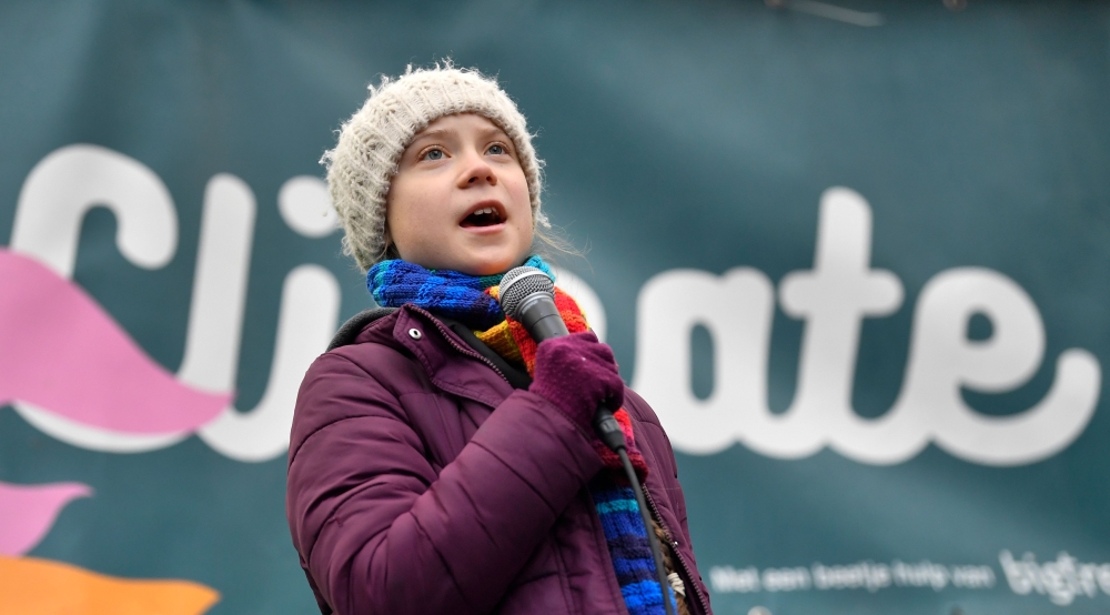 (FILES) In this file photo taken on March 6, 2020 Swedish environmentalist Greta Thunberg speaks during a 