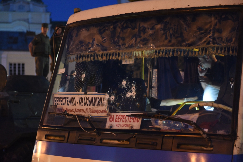 A picture shows bullets holes in the windscreen of a seized bus after police freed all hostages from a bus and arrested the armed man who held them for over 12 hours in the city of Lutsk, some 400 kilometres (250 miles) from the capital Kiev, on July 21, 