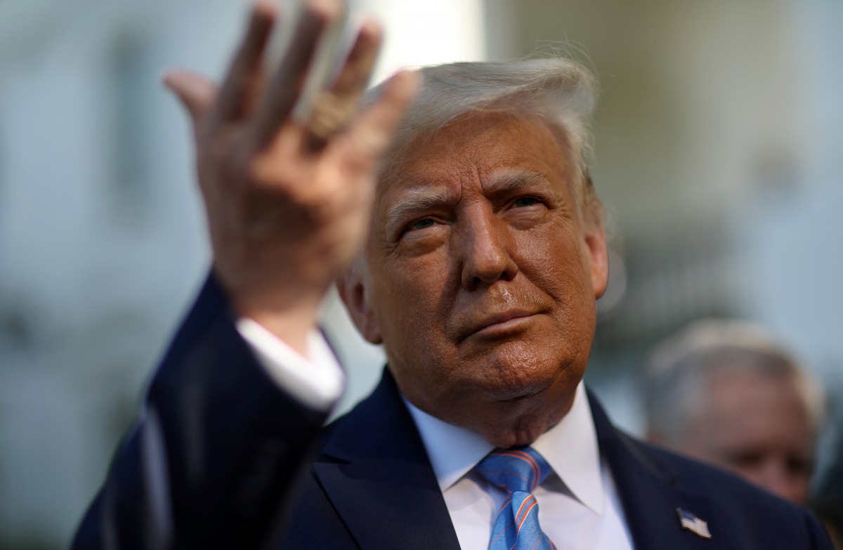 U.S. President Donald Trump speaks to the news media before departing on Marine One for travel to Midland, Texas from the South Lawn of the White House in Washington, U.S., July 29, 2020. REUTERS/Leah Millis
