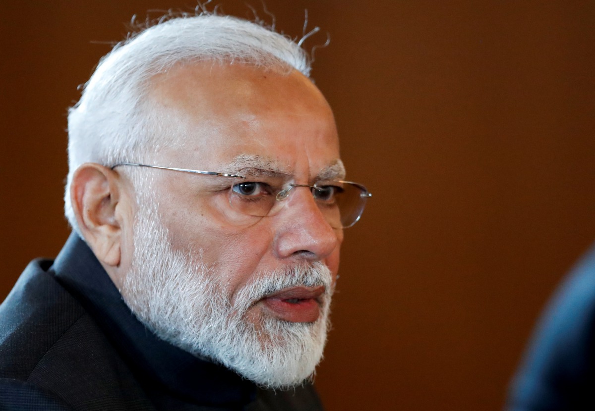 FILE PHOTO: Indian Prime Minister Narendra Modi speaks to Russian President Vladimir Putin during their meeting on the sideline of the 11th edition of the BRICS Summit, in Brasilia, Brazil November 13, 2019. Pavel Golovkin/Pool via REUTERS/File Photo