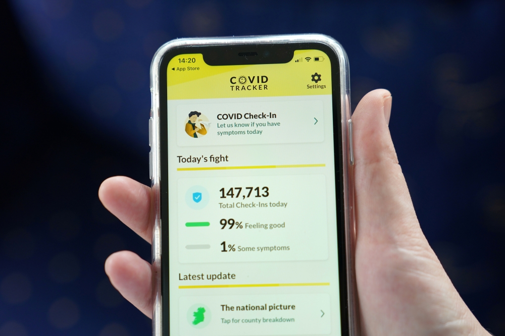 The COVID Tracker Ireland app used for contact tracing the spread of coronavirus disease (COVID-19) is displayed on a mobile phone, as it is held up for an illustration photograph in Galway, Ireland, July 30, 2020. Picture taken July 30, 2020. REUTERS/Clo