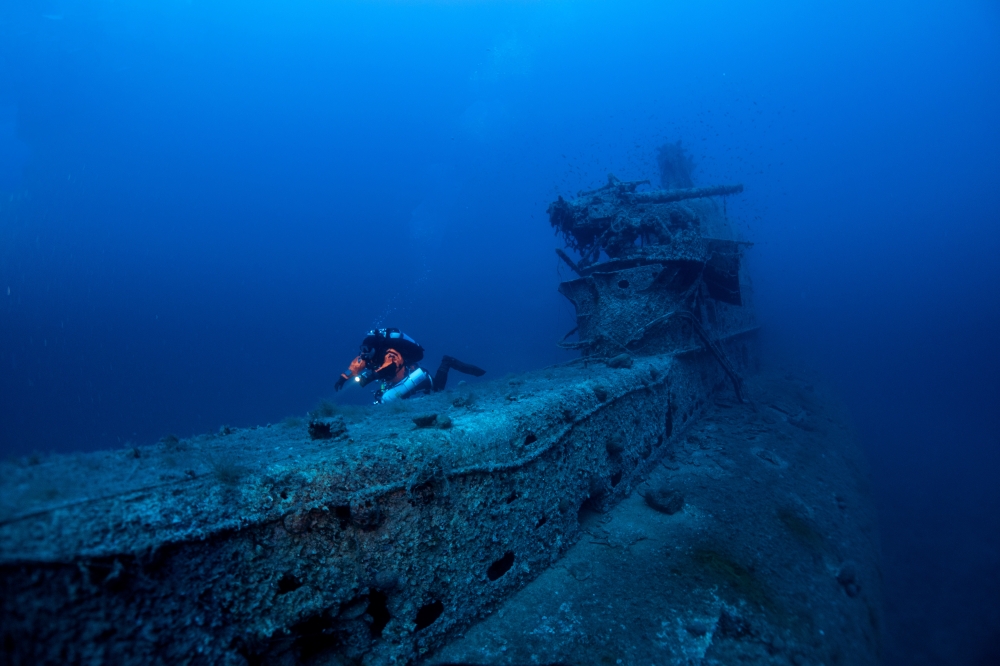 A volunteer diver of the environmental group Ghost Diving swims near the WWII wreck of the HMS Perseus, off the island of Kefalonia, Greece, July 24, 2020. Picture taken July 24, 2020. Giorgos Kolikis/Ghost Diving/Handout