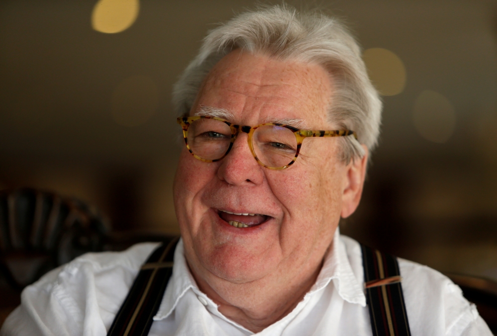 FILE PHOTO: British film director Sir Alan Parker, for the second edition of the Valletta Film Festival during which his 1978 film Midnight Express is being screened, talks to local media at a hotel in Valletta, Malta, June 4, 2016. REUTERS/Darrin Zammit 