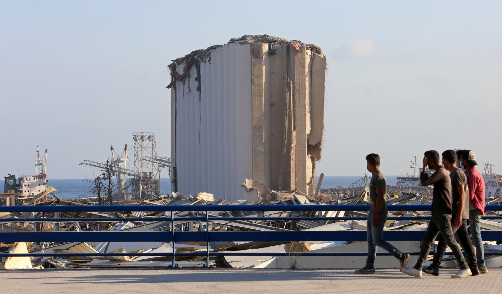 People walk near the site of Tuesday's blast in Beirut's port area, Lebanon August 6, 2020. REUTERS/Aziz Taher