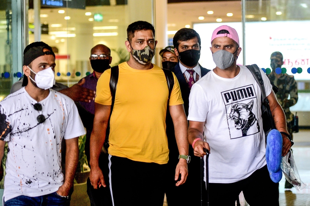 Former Captain of Indian cricket team and Captain of Chennai Super Kings, Mahendra Singh Dhoni (C), arrives from Ranchi at Birsa Munda International Airport ahead of a training session for the upcoming Indian Premier League (IPL), in Chennai. (AFP)