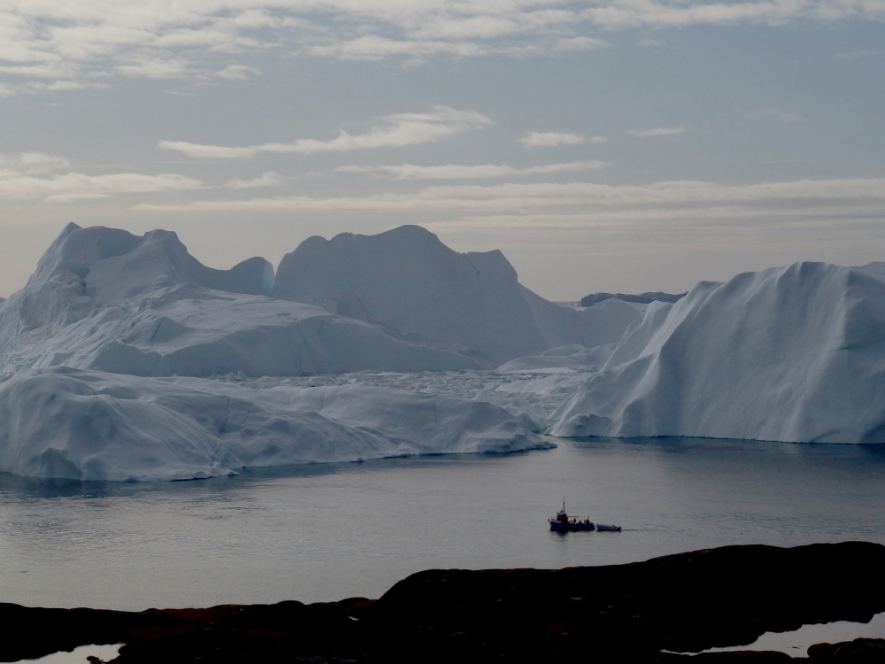 A fishing vessel sails in the ice fjord near Ilulissat, Greenland September 12, 2017. Picture taken September 12, 2017. REUTERS/Jacob Gronholt-Pedersen/File Photo