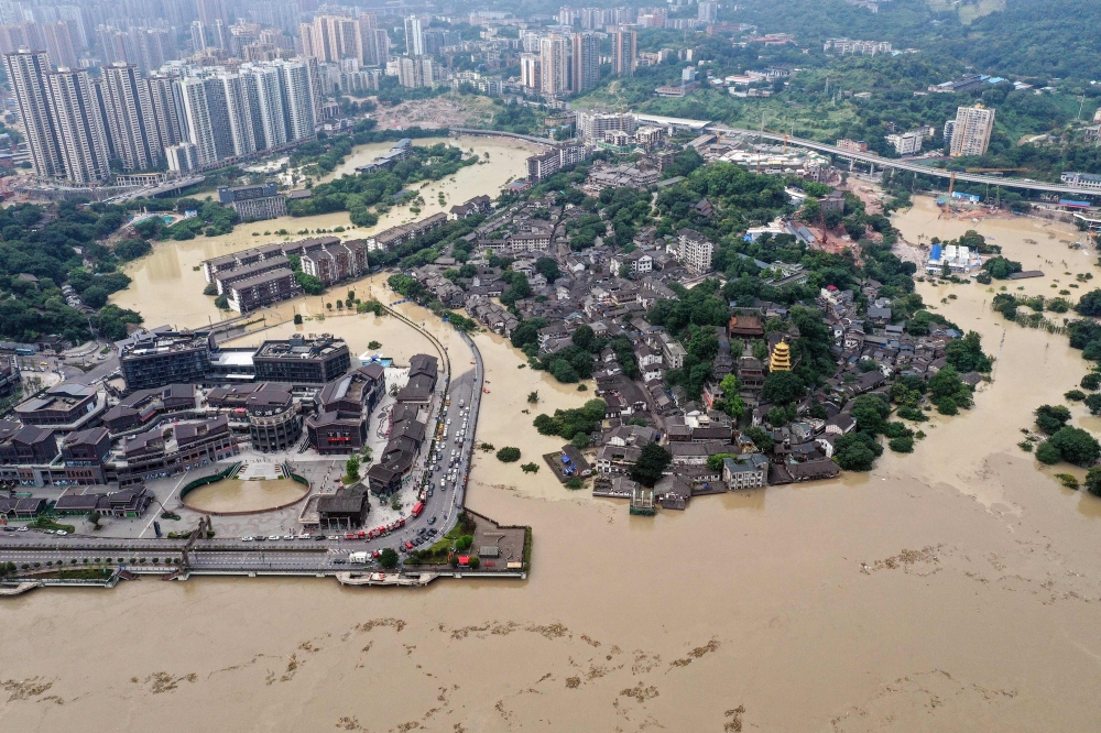 This aerial photo taken on August 19, 2020 shows a flooded area in China's southwestern Chongqing. Floods in mountainous southwest China have washed away roads and forced tens of thousands from their homes, with authorities warning on August 19 the giant 