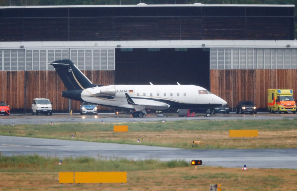 An ambulance aircraft evacuating Russian opposition leader Alexei Navalny for medical treatment in German hospital is seen on the tarmac of the Tegel airport in Berlin, Germany August 22, 2020. REUTERS/Fabrizio Bensch 
