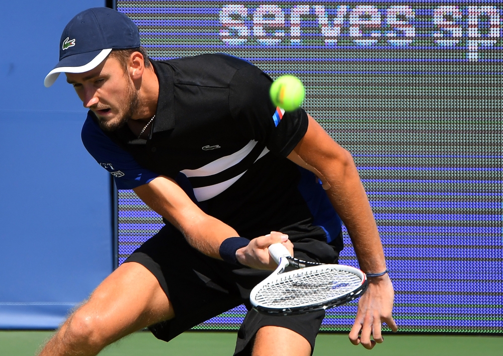 Aug 24, 2020; Flushing Meadows, New York, USA; Daniil Medvedev (RUS) returns the ball against Marcos Giron (USA) during the Western & Southern Open at the USTA Billie Jean King National Tennis Center. Robert Deutsch-USA TODAY Sports