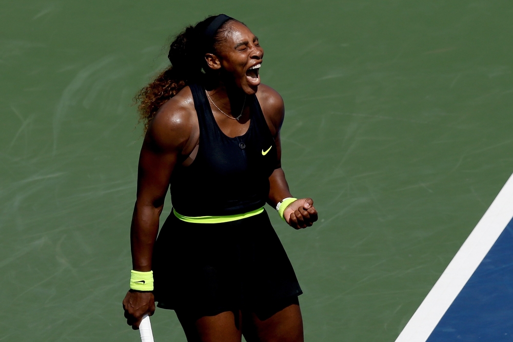 AUGUST 24: Serena Williams celebrates a point while playing Arantxa Rus of Netherlands during the Western & Southern Open at the USTA Billie Jean King National Tennis Center on August 24, 2020 in the Queens borough of New York City. Matthew Stockman/Getty