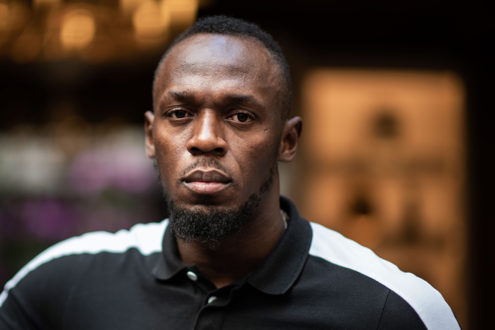 In this file photo taken on May 15, 2019 Jamaican Olympic sprinter Usain Bolt poses during a photo session as he launches a new brand of electric scooters named 