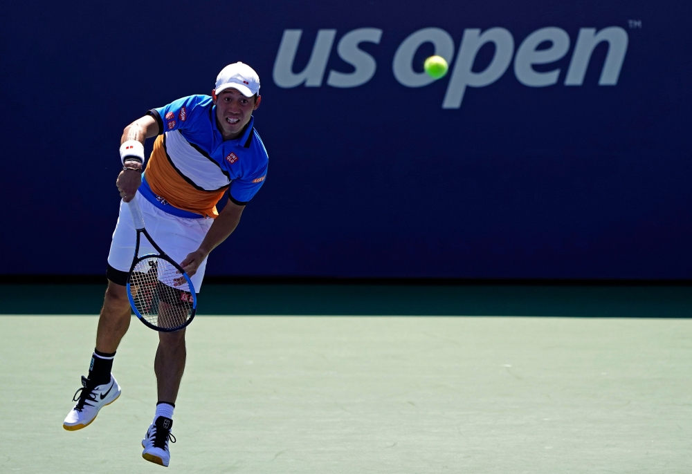 In this file photo taken on August 30, 2019, Kei Nishikori of Japan serves during his Men's Singles third round match against Alex de Minaur of Australia on day five of the 2019 US Open in New York City. / AFP / GETTY IMAGES NORTH AMERICA / GETTY IMAGES N