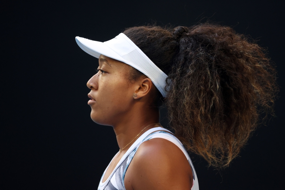 In this file photo taken on January 24, 2020 Japan's Naomi Osaka gets ready to face Coco Gauff of the US in their women's singles match on day five of the Australian Open tennis tournament in Melbourne.  / AFP / DAVID GRAY 