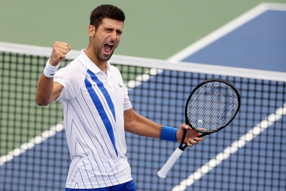 In this file photo Novak Djokovic of Serbia celebrates his win over Milos Raonic of Canada in the men's singles final of the Western & Southern Open at the USTA Billie Jean King National Tennis Center on August 29, 2020 in the Queens borough of New York C