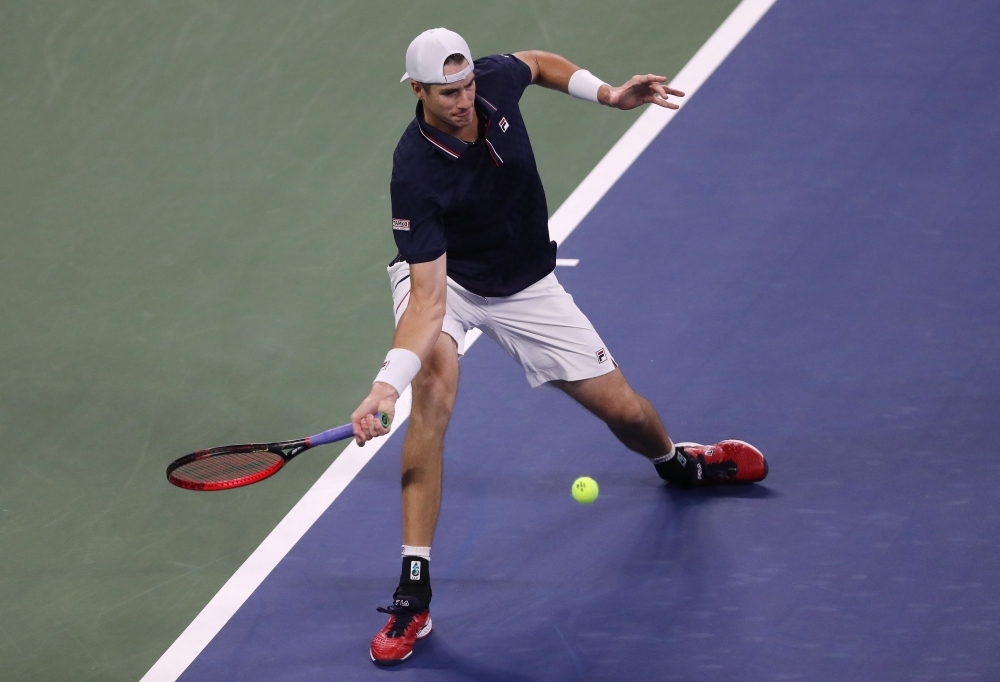 John Isner of the United States returns a volley during his Men's Singles first round match against Steve Johnson of the United States on Day One of the 2020 US Open at the USTA Billie Jean King National Tennis Center on August 31, 2020 in the Queens boro