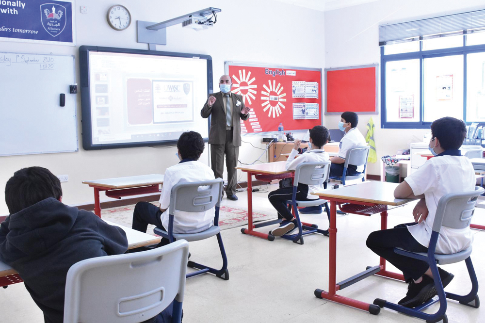 Students attending a class in a Ta’allum school on the first day of school reopening, yesterday.  