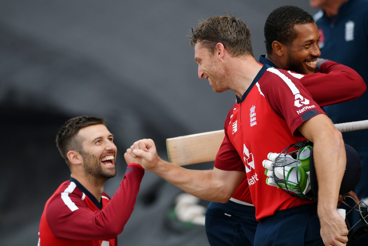 Cricket - Second T20 International - England v Australia - Ageas Bowl, Southampton, Britain - September 6, 2020 England's Jos Buttler and Mark Wood celebrate after the match Dan Mullan/Pool via REUTERS
